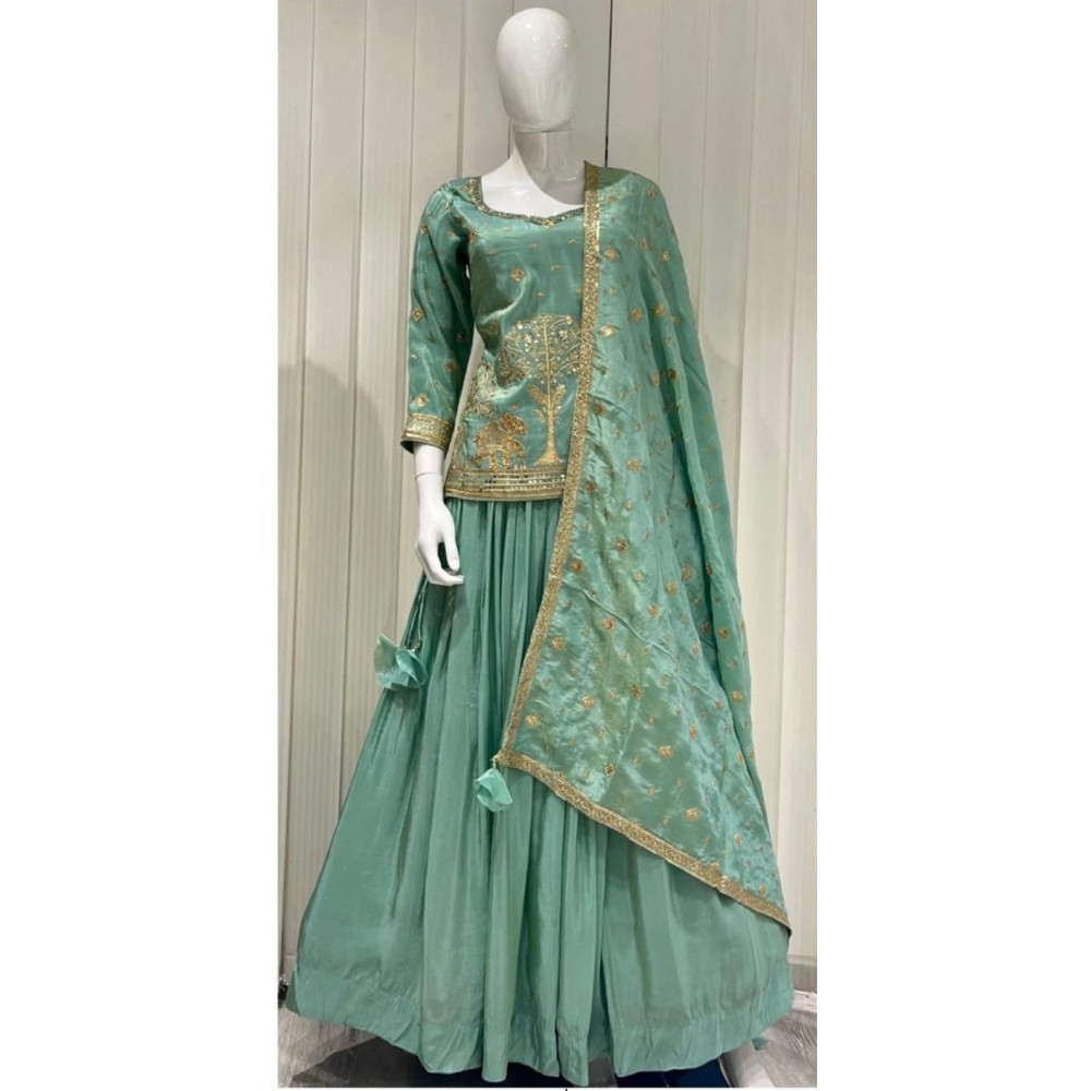 green lehenga with longer top delicate embroidery
